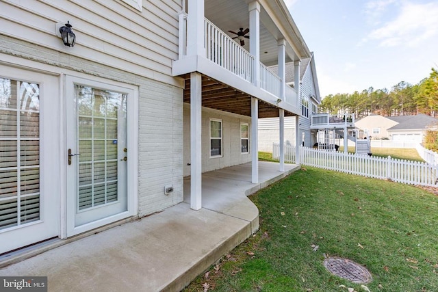 view of yard featuring fence, a patio, and ceiling fan