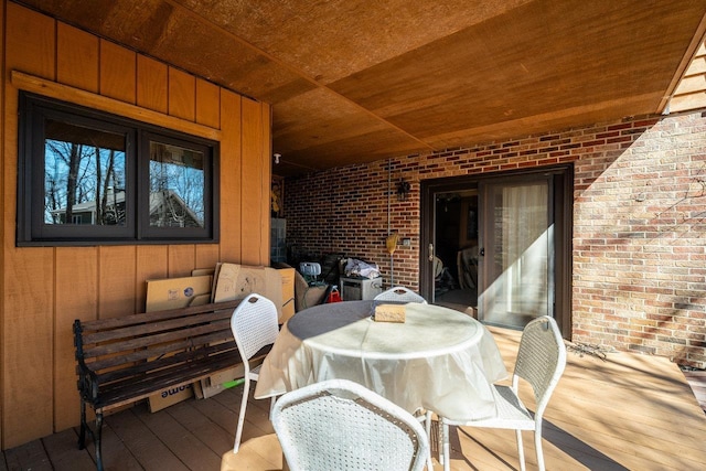 wooden terrace featuring outdoor dining area
