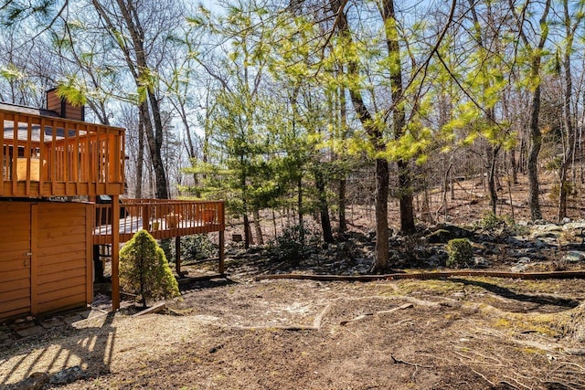 view of yard featuring a wooden deck