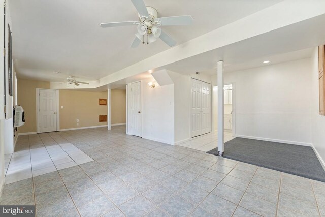 unfurnished living room featuring light tile patterned flooring, ceiling fan, baseboards, and recessed lighting