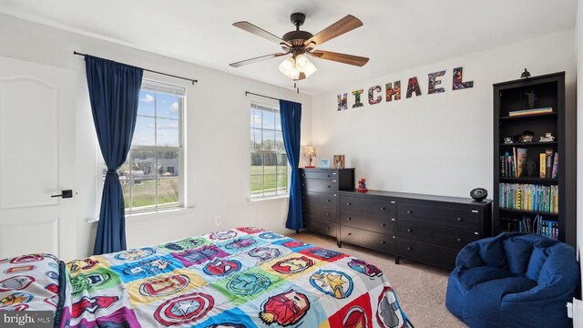 bedroom featuring carpet and a ceiling fan