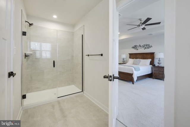 bathroom featuring ensuite bathroom, baseboards, a stall shower, and ceiling fan