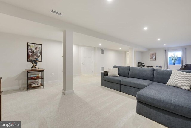 living area featuring baseboards, recessed lighting, light carpet, and visible vents