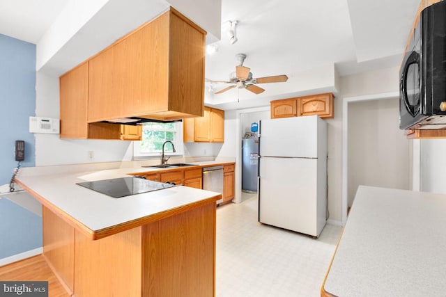 307 Butternut Dr, Fredericksburg, VA 22408 - kitchen featuring black appliances, a ceiling fan, a peninsula, light countertops, and a kitchen bar