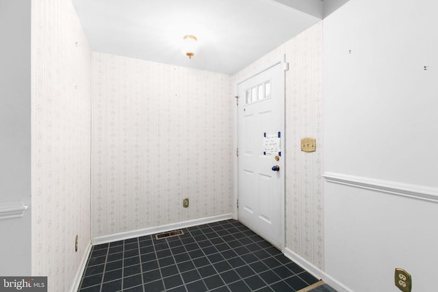 307 Butternut Dr, Fredericksburg, VA 22408 - spare room with wallpapered walls and tile patterned flooring
