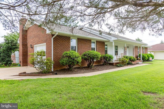 307 Butternut Dr, Fredericksburg, VA 22408 - view of front of property with brick siding, a porch, an attached garage, a front yard, and concrete driveway