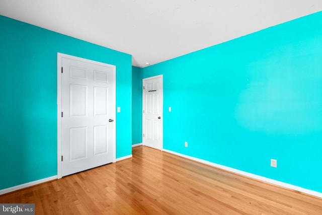 307 Butternut Dr, Fredericksburg, VA 22408 - unfurnished bedroom featuring wood finished floors and baseboards