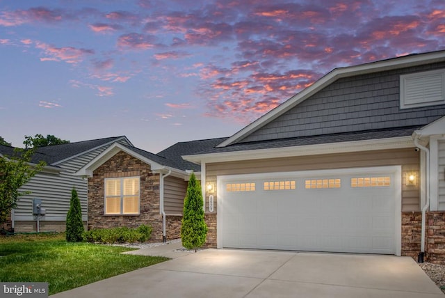 8859 Marlow Dr, Spotsylvania, VA 22551 - view of front of house featuring stone siding, concrete driveway, an attached garage, and a shingled roof
