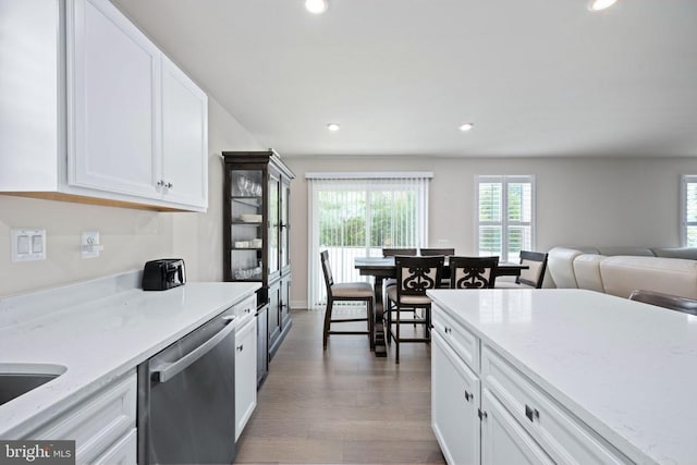 8859 Marlow Dr, Spotsylvania, VA 22551 - kitchen featuring stainless steel dishwasher, white cabinets, recessed lighting, wood finished floors, and open floor plan