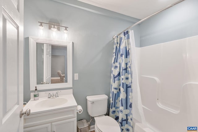 full bath with toilet, shower / bath combo, and vanity