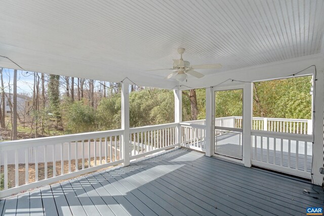 wooden terrace with a ceiling fan