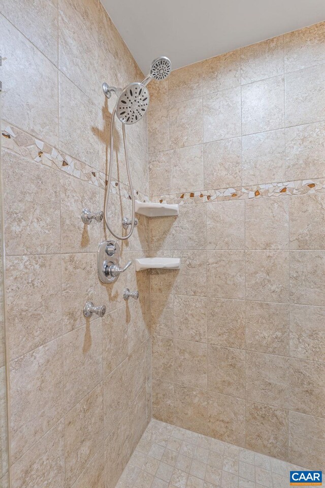 bathroom with a tile shower