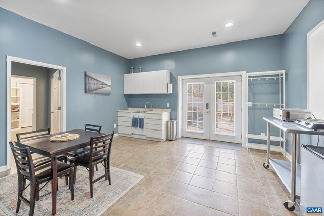 dining area featuring baseboards, french doors, light tile patterned floors, and recessed lighting