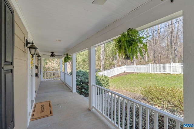 view of patio with covered porch, fence private yard, and a ceiling fan