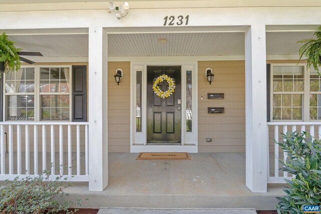 property entrance with covered porch