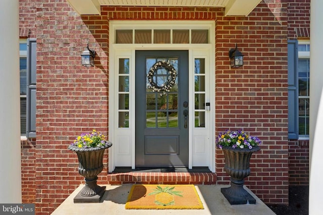 property entrance with brick siding