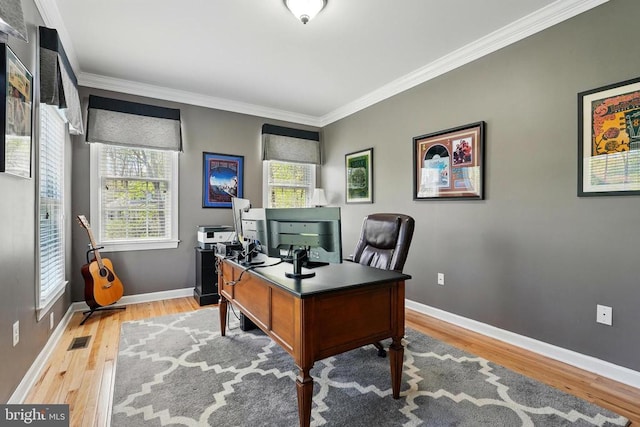 office with crown molding, wood finished floors, and baseboards