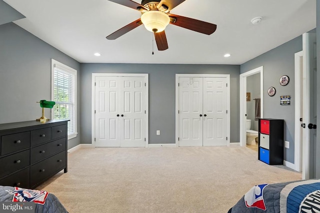 bedroom with multiple closets, light colored carpet, baseboards, recessed lighting, and a ceiling fan