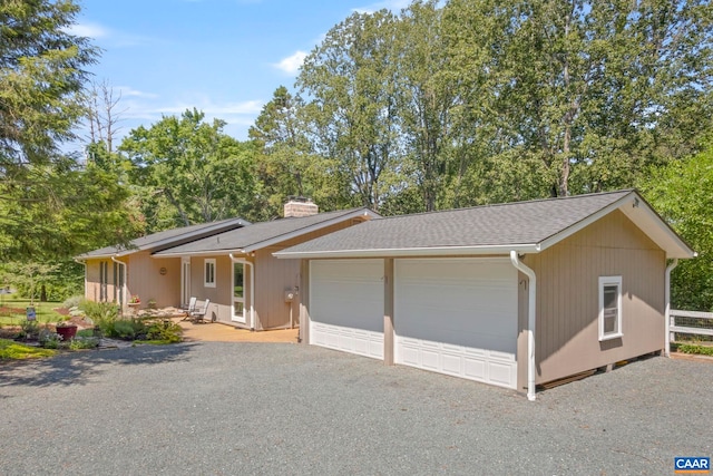 310 Gloucester Rd, Charlottesville, VA 22901 - ranch-style house with a chimney, a garage, and a shingled roof
