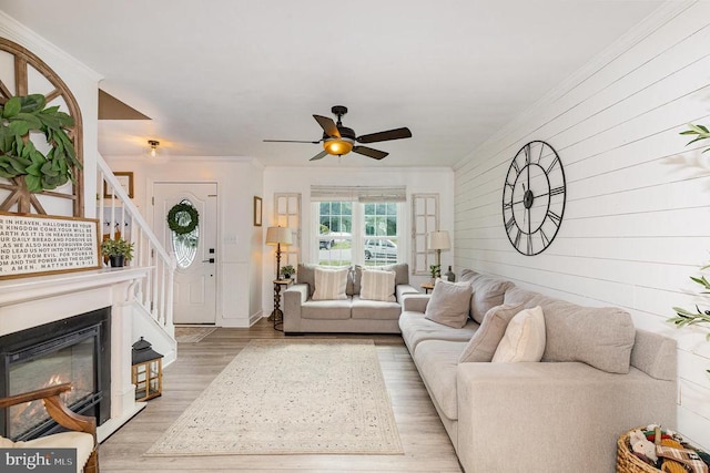 4511 Cornwall Ct, Fredericksburg, VA 22408 - living area featuring wood finished floors, ornamental molding, a ceiling fan, stairway, and wood walls