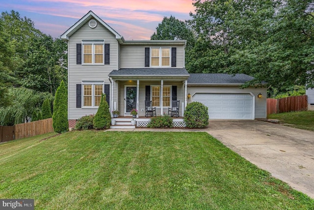 4511 Cornwall Ct, Fredericksburg, VA 22408 - traditional-style house with covered porch, driveway, and an attached garage