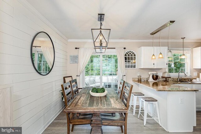 4511 Cornwall Ct, Fredericksburg, VA 22408 - dining room featuring wood finished floors, ornamental molding, and wooden walls