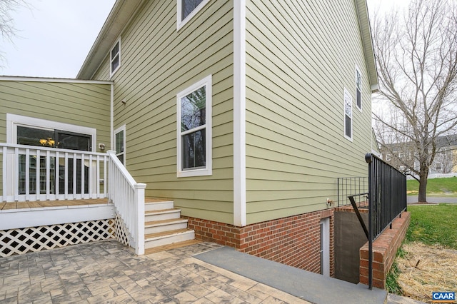 view of side of property featuring a patio