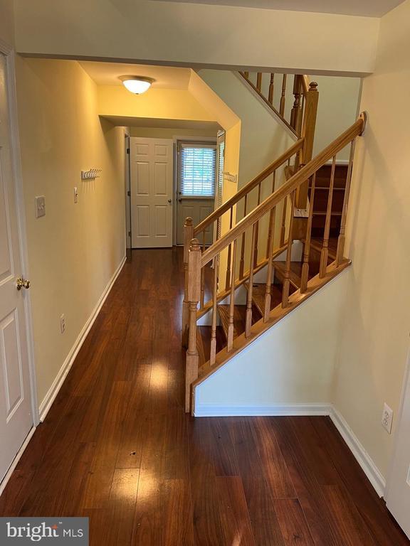 9808 Bartley Ct, Fredericksburg, VA 22408 - entrance foyer with stairs, wood-type flooring, and baseboards
