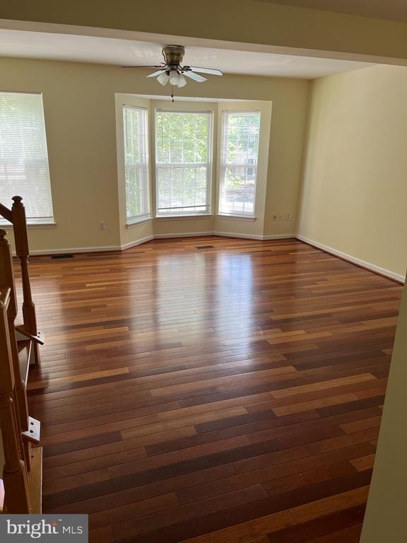 9808 Bartley Ct, Fredericksburg, VA 22408 - spare room with ceiling fan, healthy amount of natural light, and dark wood-style flooring