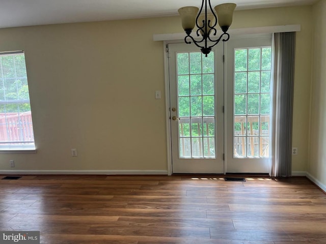 9808 Bartley Ct, Fredericksburg, VA 22408 - doorway featuring a chandelier, wood finished floors, and baseboards
