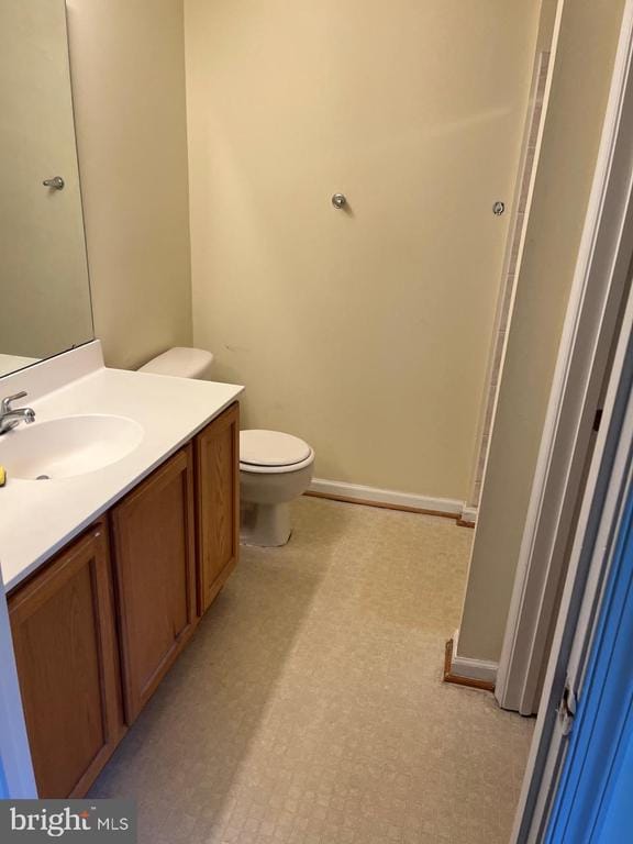 9808 Bartley Ct, Fredericksburg, VA 22408 - bathroom with vanity, toilet, and baseboards