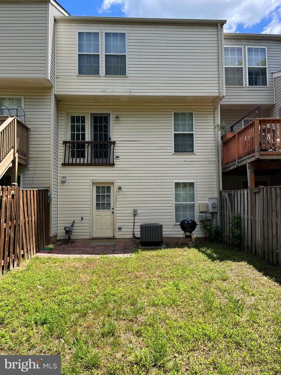 9808 Bartley Ct, Fredericksburg, VA 22408 - back of property featuring cooling unit and a patio area