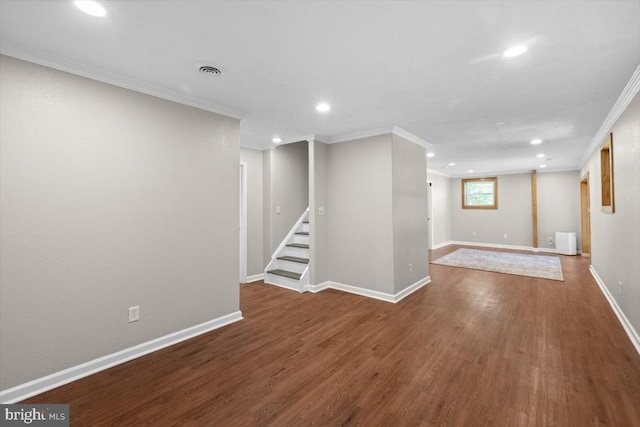 basement featuring crown molding, recessed lighting, wood finished floors, stairs, and baseboards