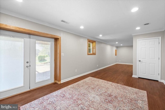 basement with ornamental molding, wood finished floors, recessed lighting, baseboards, and french doors