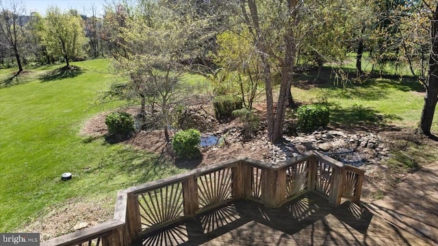 wooden deck with a yard