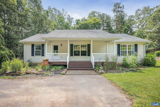 3615 Doctors Xing, Charlottesville, VA 22911 - ranch-style house featuring covered porch, a front lawn, a shingled roof, and driveway