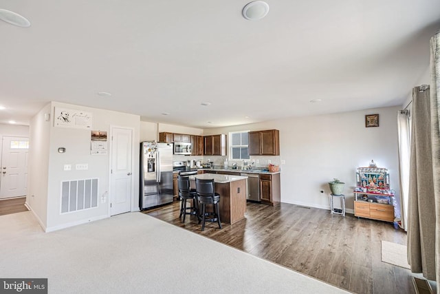 2612 High Pt, Culpeper, VA 22701 - kitchen featuring appliances with stainless steel finishes, a center island, baseboards, a breakfast bar area, and recessed lighting