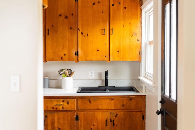 123 Fraser Ln, Staunton, VA 24401 - kitchen with a sink, light countertops, and brown cabinets