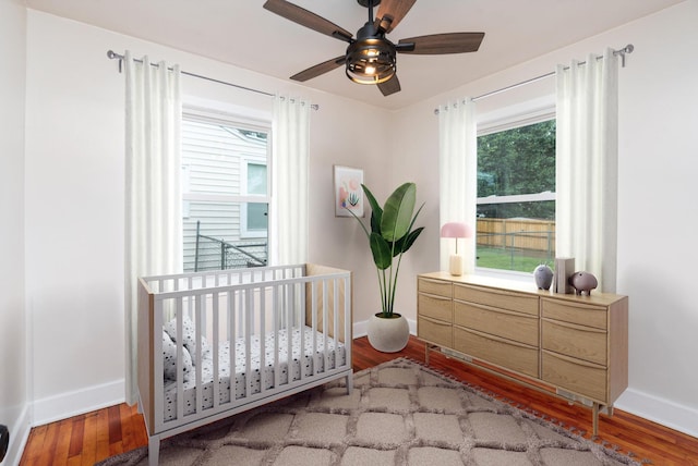 123 Fraser Ln, Staunton, VA 24401 - bedroom featuring baseboards, wood finished floors, a nursery area, and ceiling fan