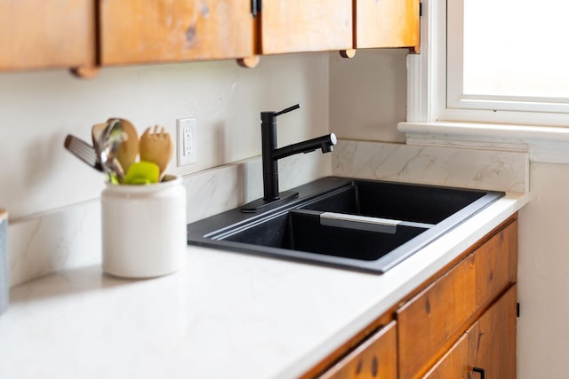 123 Fraser Ln, Staunton, VA 24401 - kitchen featuring a sink, light countertops, decorative backsplash, and brown cabinets