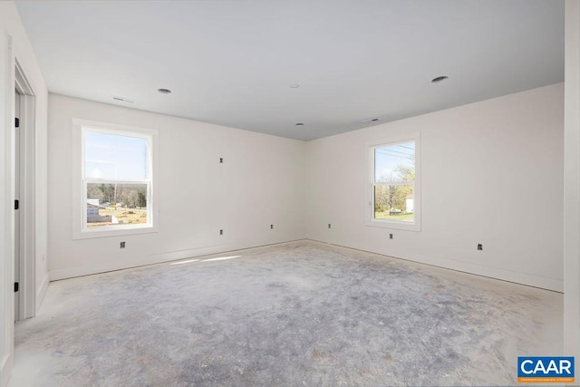 spare room featuring baseboards