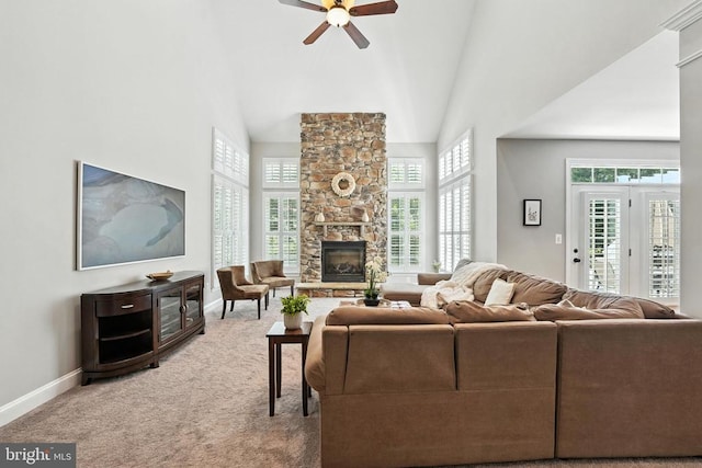 11220 Chivalry Chase Ln, Spotsylvania, VA 22551 - carpeted living room with a high ceiling, a stone fireplace, and ceiling fan