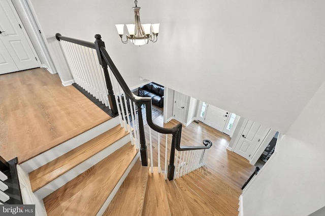 11220 Chivalry Chase Ln, Spotsylvania, VA 22551 - stairway with wood finished floors and a chandelier