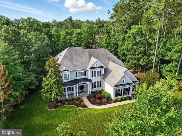 11220 Chivalry Chase Ln, Spotsylvania, VA 22551 - view of front of home featuring a front lawn, a view of trees, a porch, and roof with shingles