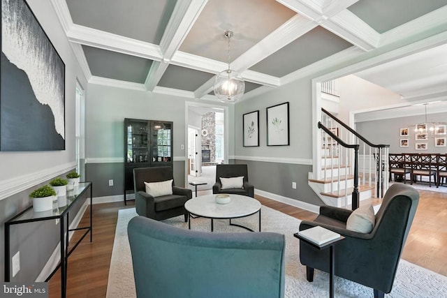11220 Chivalry Chase Ln, Spotsylvania, VA 22551 - living room featuring coffered ceiling, a chandelier, stairs, wood finished floors, and beam ceiling