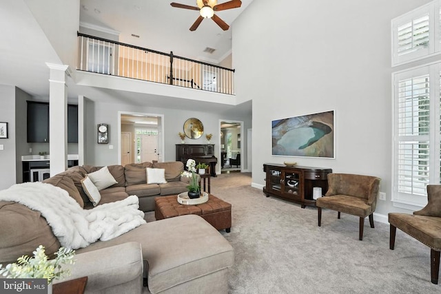 11220 Chivalry Chase Ln, Spotsylvania, VA 22551 - carpeted living area featuring ceiling fan, high vaulted ceiling, plenty of natural light, and ornate columns