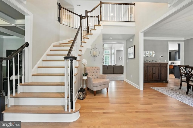 11220 Chivalry Chase Ln, Spotsylvania, VA 22551 - staircase with wood finished floors and ornamental molding