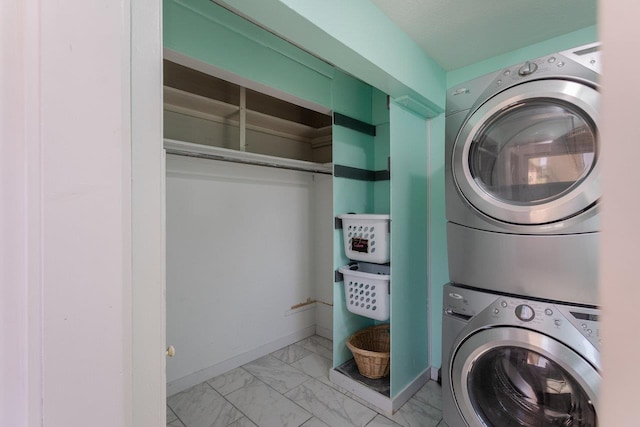 508 Stuart Ave N, Elkton, VA 22827 - laundry area with estacked washer and dryer and light marble finish flooring