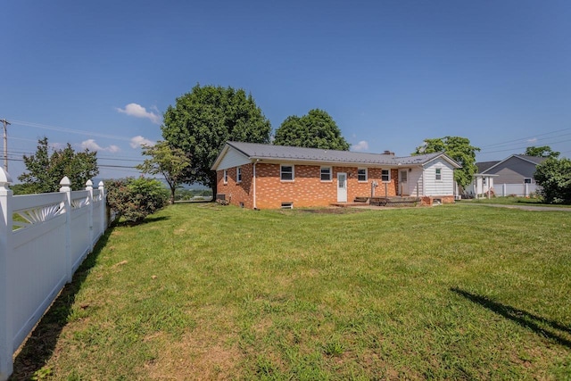508 Stuart Ave N, Elkton, VA 22827 - rear view of property featuring brick siding, crawl space, and a chimney