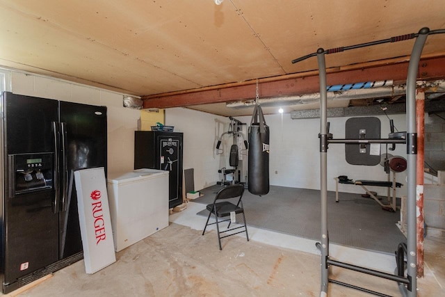 508 Stuart Ave N, Elkton, VA 22827 - below grade area featuring black fridge, fridge, and concrete block wall